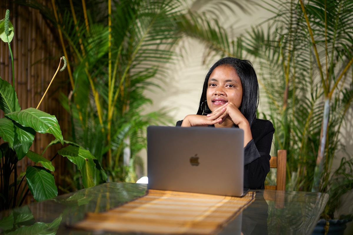 A professional working at a laptop